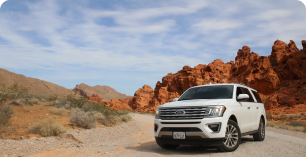 White truck on a gravel road